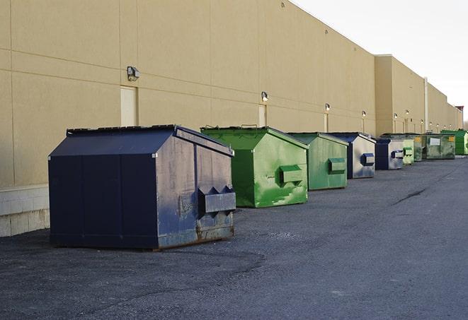 construction waste bins waiting to be picked up by a waste management company in Canton, CT